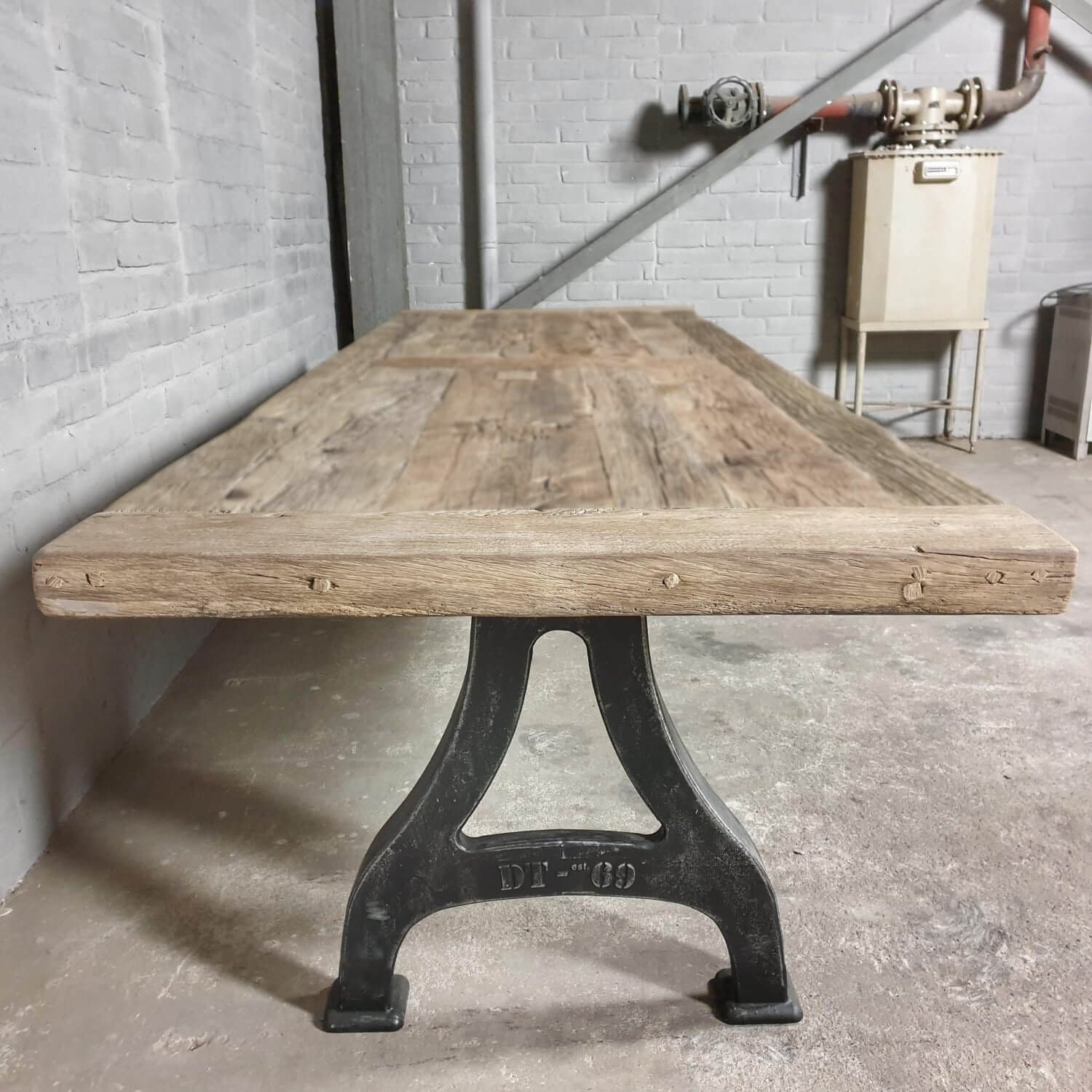 Industrial design table cast iron legs sustainable oak top IND719