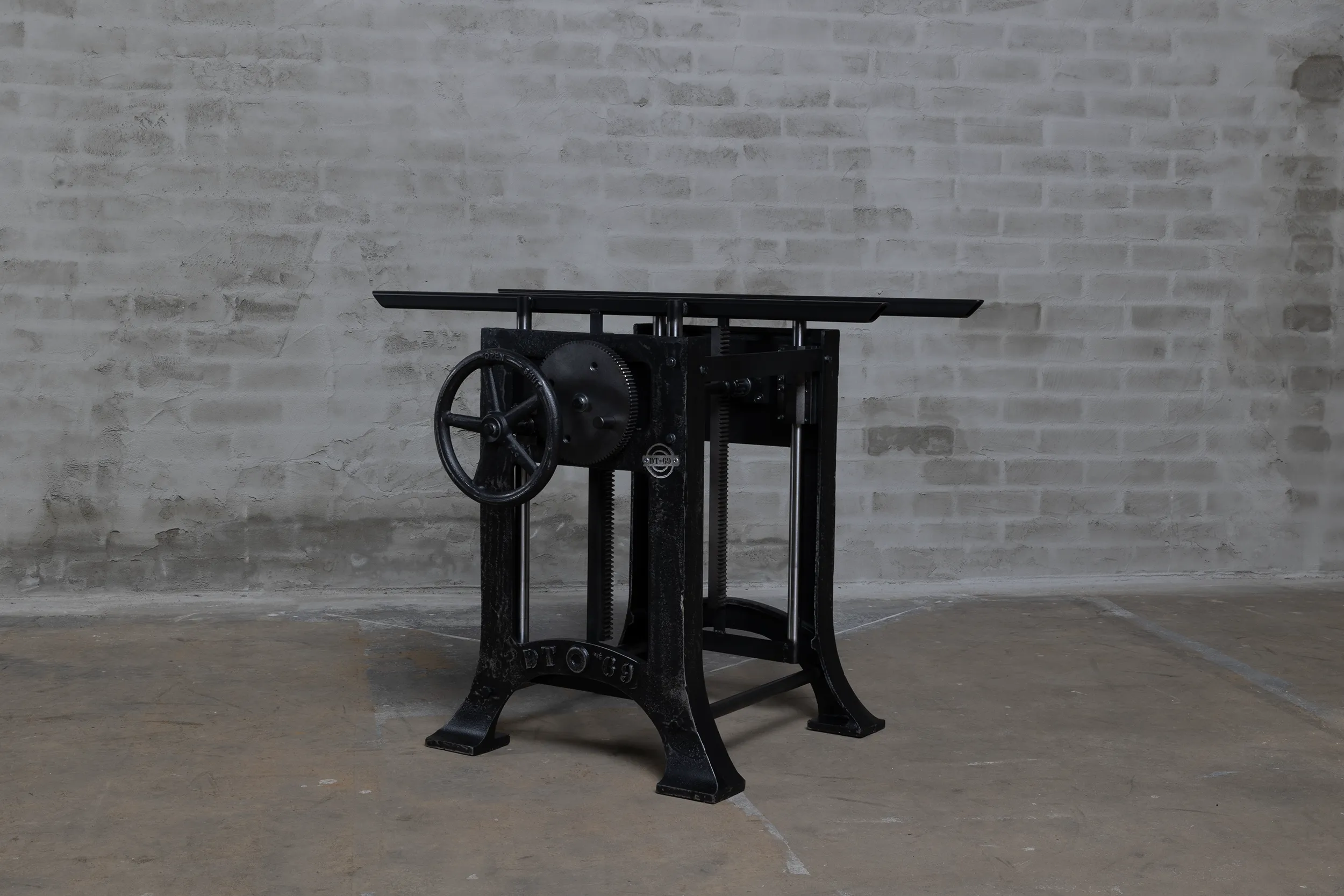 Separate height adjustable table legs put in a lower mode