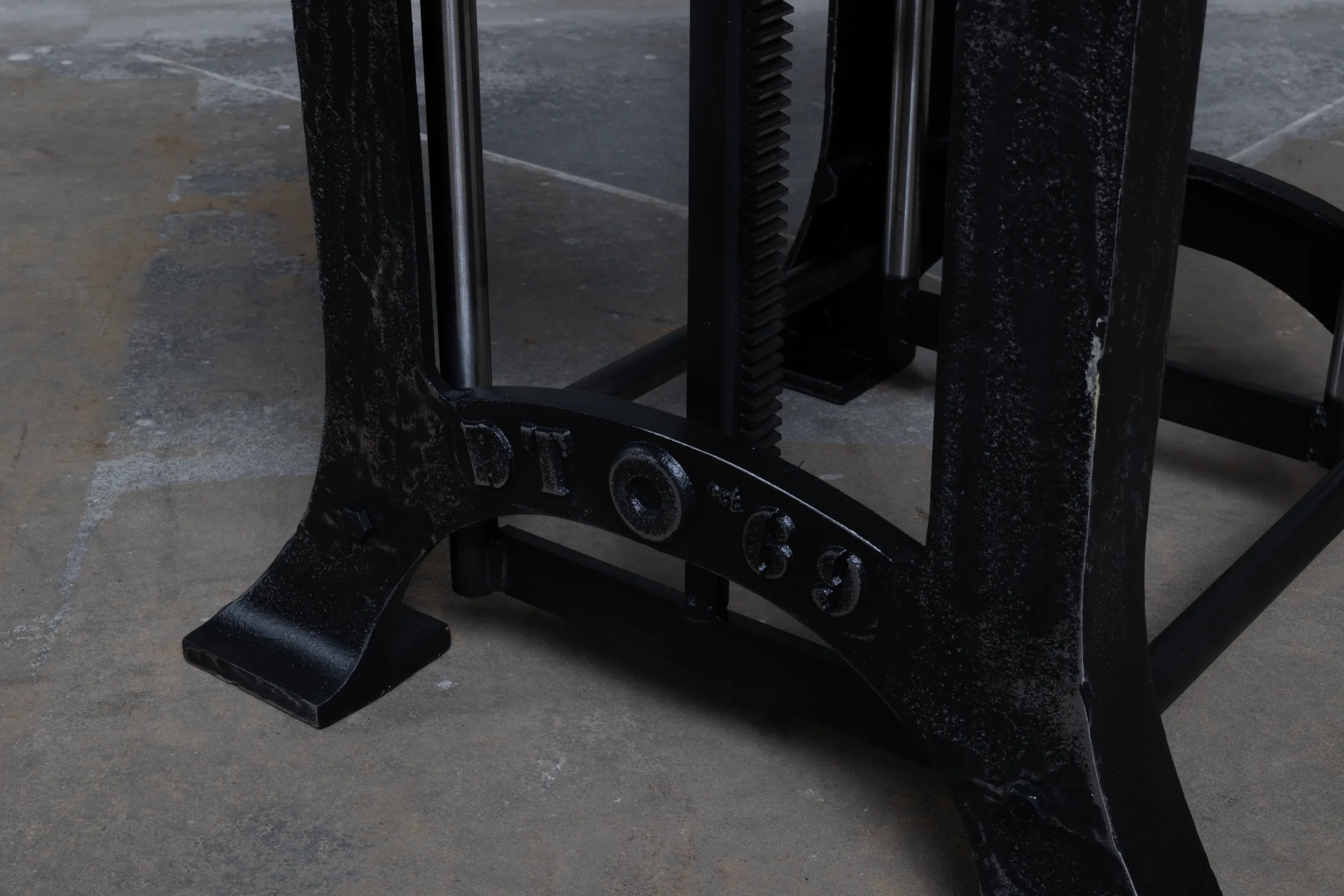 Separate height adjustable table legs closeup from lower legs