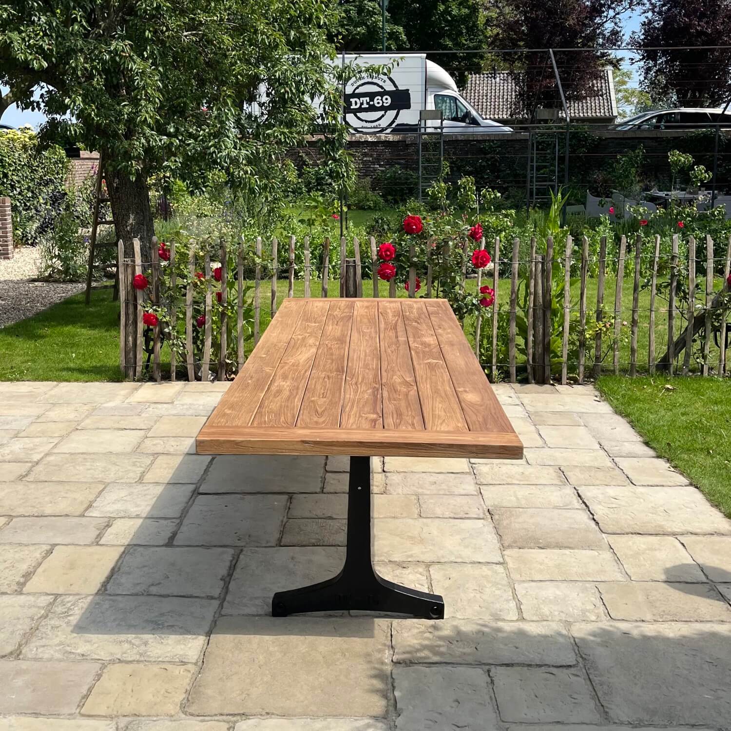 Industrial design garden table with cast iron legs and teak top T13