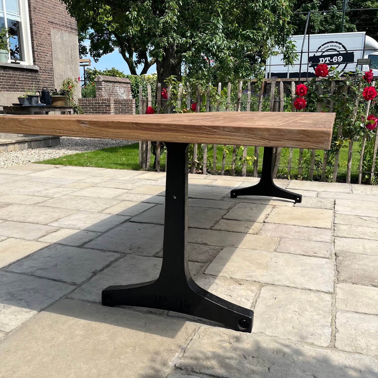 Industrial design garden table with cast iron legs and teak top T13